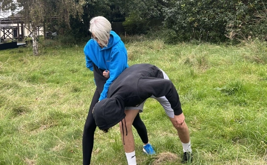 Natalie coaching a self defence class outdoors